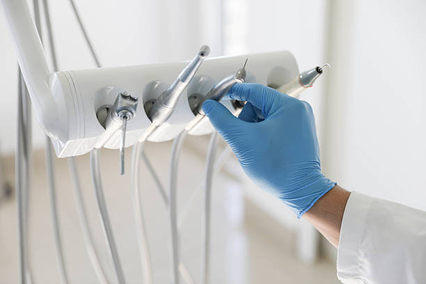 Professional Tooth Extraction technician working in Forsyth County County, GA